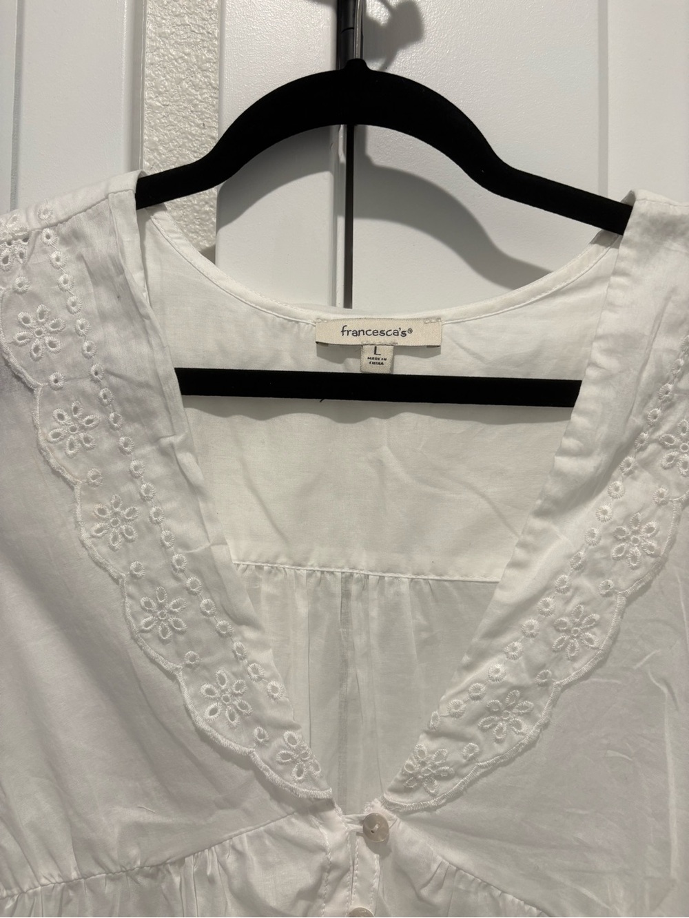Francesca's Collections White Eyelet Button-Front Peplum Sleeveless Top - Picture 2 of 4